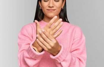 Woman suffering from hand pain